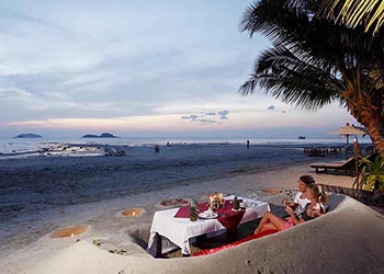 sand sofa barefoot dining