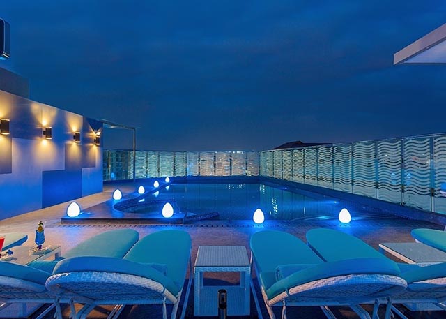 photos of the gym & rooftop pool at centra avenue hotel